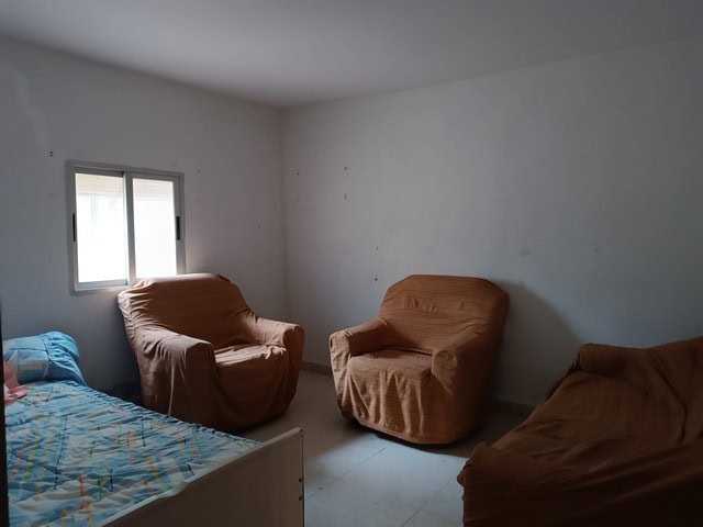 Interior view of a rural property in Baza, Granada with simple furniture and natural light.