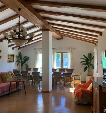Elegant interior of a town house in Cullar, Granada with wooden beams and spacious living area.