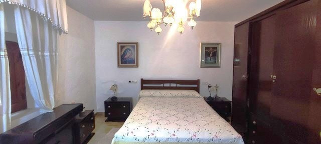 Rural property bedroom in Seron, Almeria with traditional decor and spacious layout.