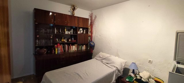 Charming rural property interior in Seron, Almeria, featuring a cozy bedroom with vintage furniture.
