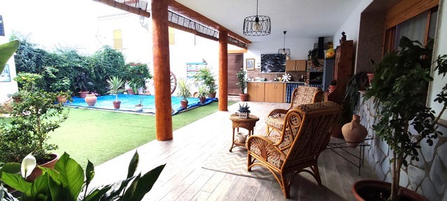 Beautiful village property in Albanchez, Almeria, featuring a spacious outdoor terrace and lush gard.