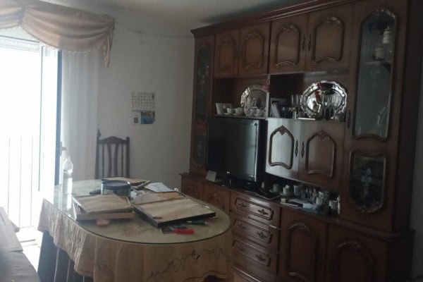 Cozy interior of a village property in Hinojares, Jaen, featuring a dining area and traditional wood.