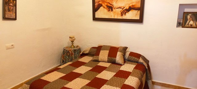 Traditional cave house interior in Benamaurel, Granada, showcasing rustic charm and unique living sp.