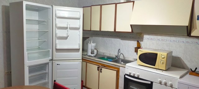 Interior view of a small kitchen in a village property in Benamaurel, Granada.
