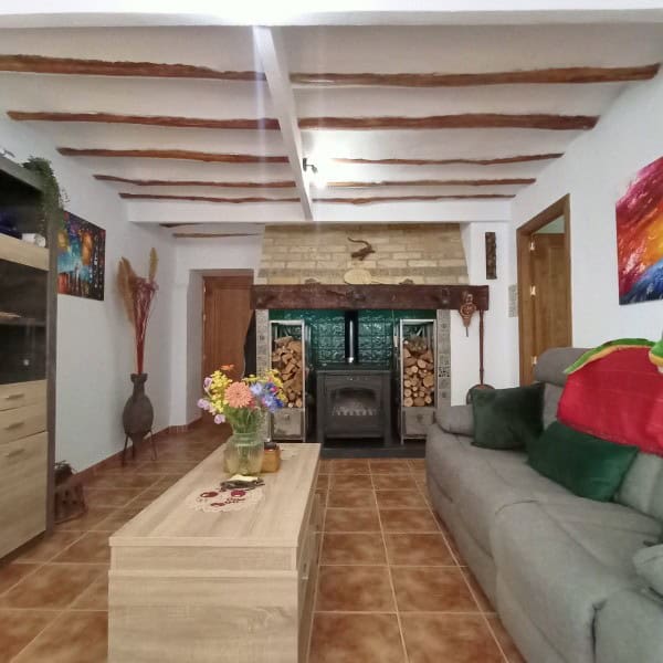 Charming interior of a village property in Hinojares, Jaen, featuring rustic wooden beams and a cozy.