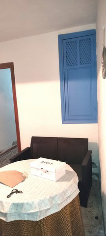 Cozy interior with blue window shutters in Tijola, Almeria.