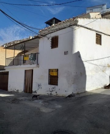 Charming village house in Galera, Granada, with traditional white walls and rustic features.