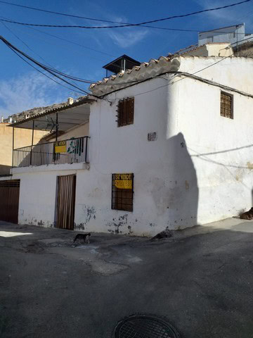 Charming village house in Galera, Granada, with traditional white walls and rustic features.