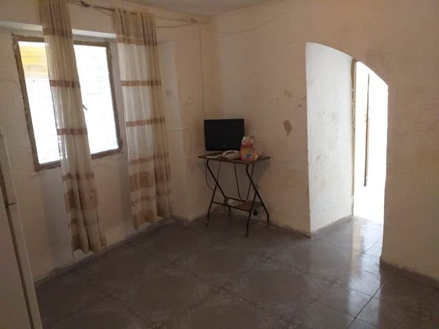 Charming interior of a village property in Galera, Granada, featuring simple decor and natural light.
