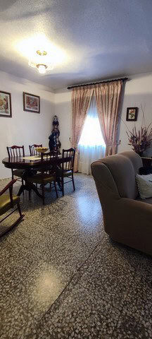 Charming town house interior in Tijola, Almeria, featuring a cozy living and dining area with tradit.