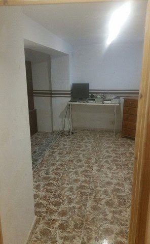 Interior view of village property in Seron, Almeria with simple furnishings.