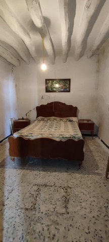 Charming interior of a traditional town house in Tijola, Almeria, featuring rustic ceilings and vint.