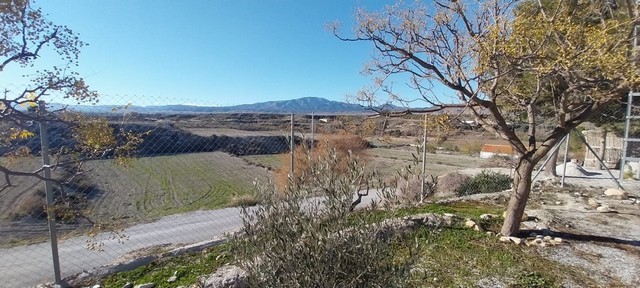 Beautiful view of the cave house in Cantarranas, Granada with scenic landscape and mountains in the.