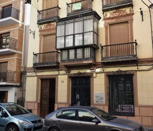Elegant town house in Baza, Granada featuring traditional architecture and charming balconies.