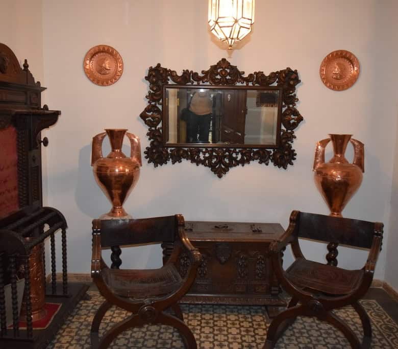 Charming interior of a town house in Baza, Granada featuring vintage furniture, decorative vases, an.