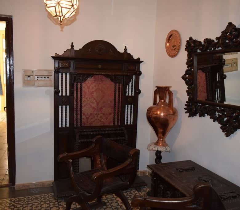 Charming interior of a traditional town house in Baza, Granada, featuring antique furniture and orna.
