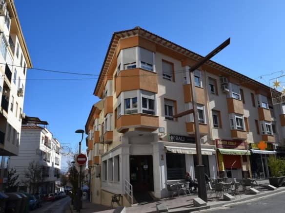 Modern apartment building in Baza, Granada featuring contemporary architecture and urban surrounding.
