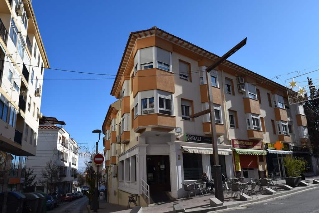 Modern apartment building in Baza, Granada featuring contemporary architecture and urban surrounding.