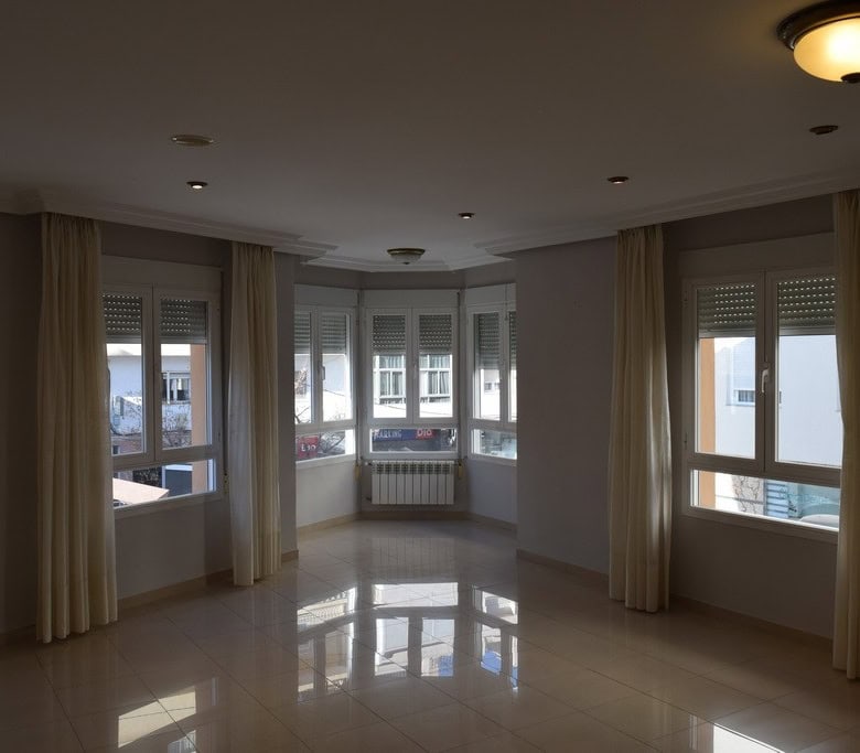 Bright living room with large windows in Baza, Granada.