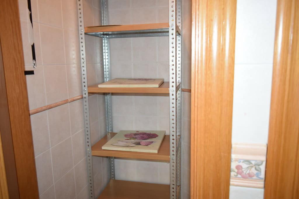 Storage shelf in apartment in Baza, Granada for organized living.