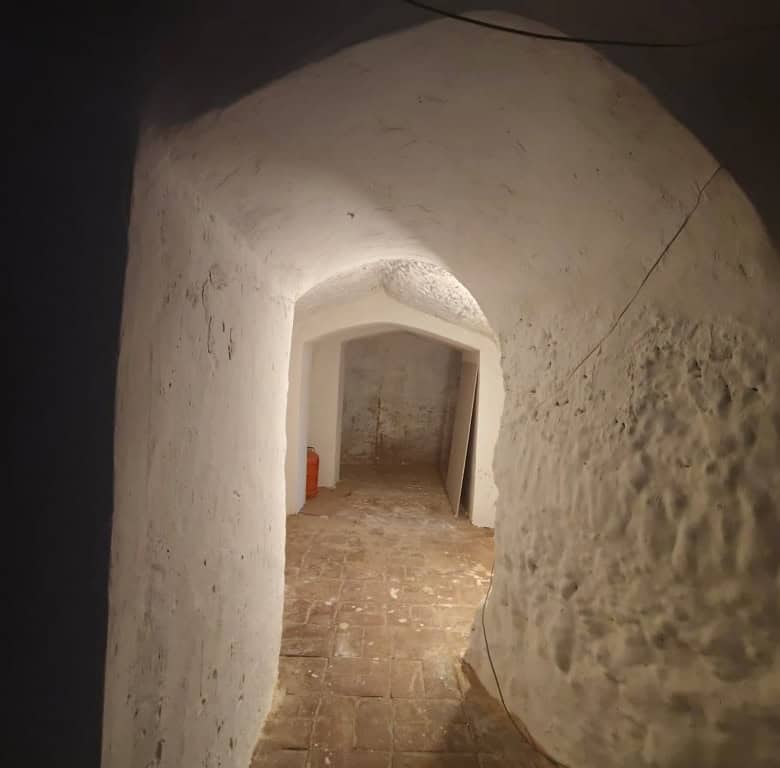 Cave house interior in Guadix, Granada, showcasing traditional underground living space.