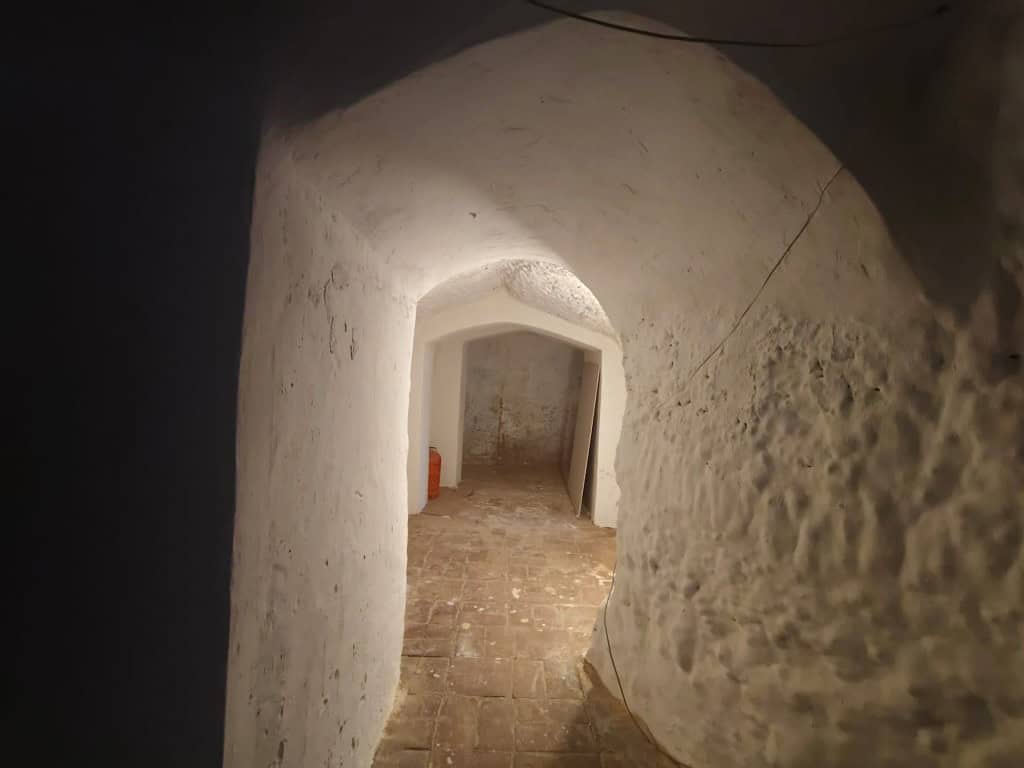 Cave house interior in Guadix, Granada, showcasing traditional underground living space.