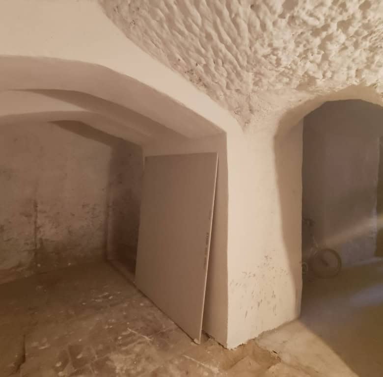 Cave house interior in Guadix, Granada, showcasing traditional underground living spaces.