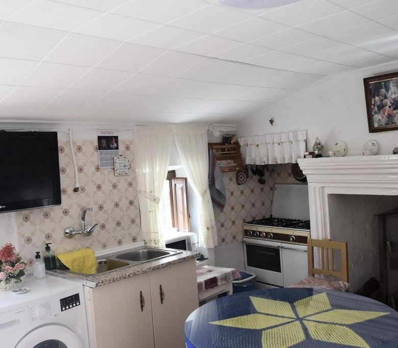 Charming rural property in Castril, Granada featuring a rustic kitchen and living area with traditio.