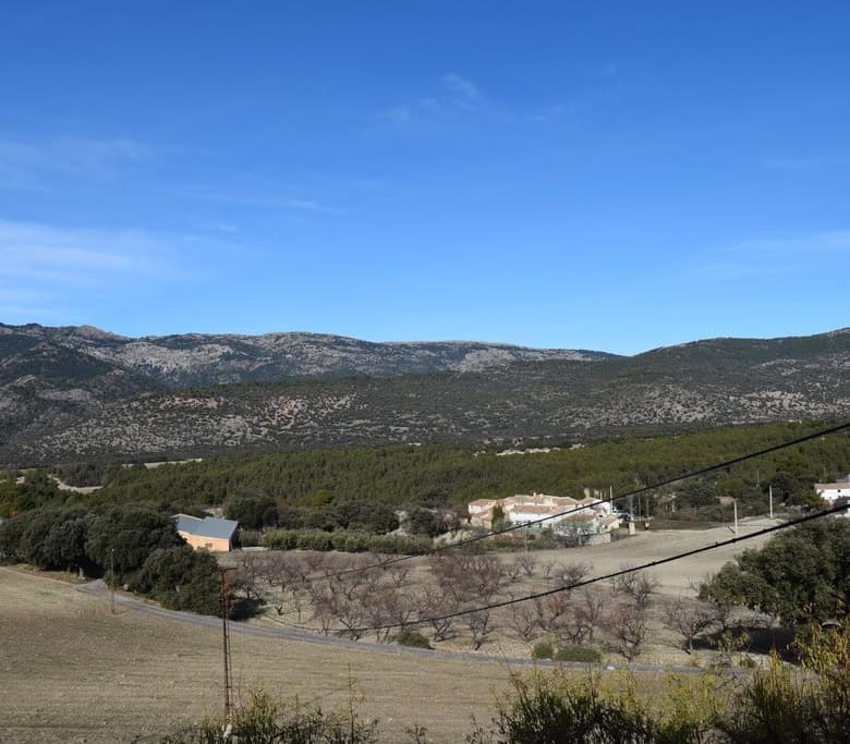 Scenic view of rural land and mountains in Pozo Alcon, Jaen, ideal for countryside living or investm.