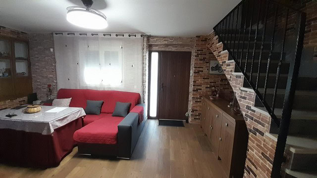 Charming village home in Bayarque, Almeria, featuring a comfortable living area with brick accents a.