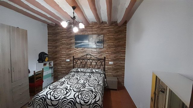 Charming village property in Bayarque, Almeria with rustic interior and cozy bedroom. Ideal for peac.