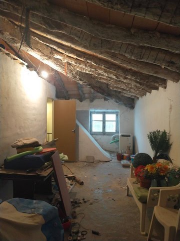 Charming interior of a village property in Los Olivos, Granada, showing rustic ceiling and renovatio.