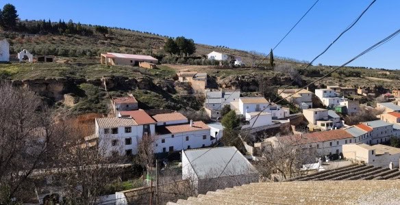 Village property in Fontanar, Jaen with traditional white houses and scenic hillside views.