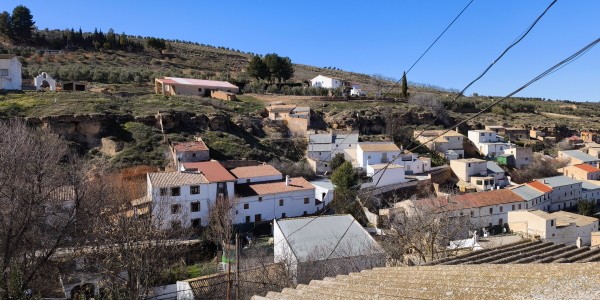 Village property in Fontanar, Jaen with traditional white houses and scenic hillside views.