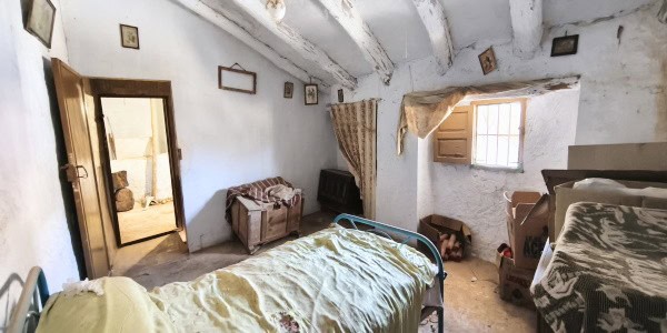Charming village house in Fontanar, Jaen, featuring rustic interiors and traditional architecture.