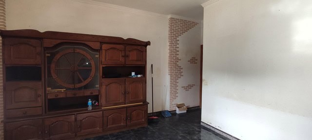 Rural property interior in Seron, Almeria, featuring a wooden cabinet and unfinished wall. Ideal for.