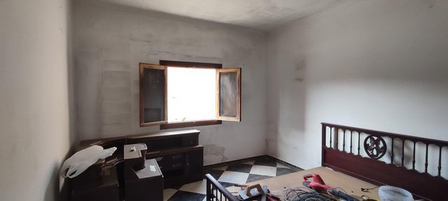 Interior of a rustic rural property in Seron, Almeria, showing an unfinished room with a window and.