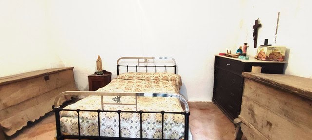 Charming rural bedroom in Seron, Almeria with vintage furniture and simple decor.