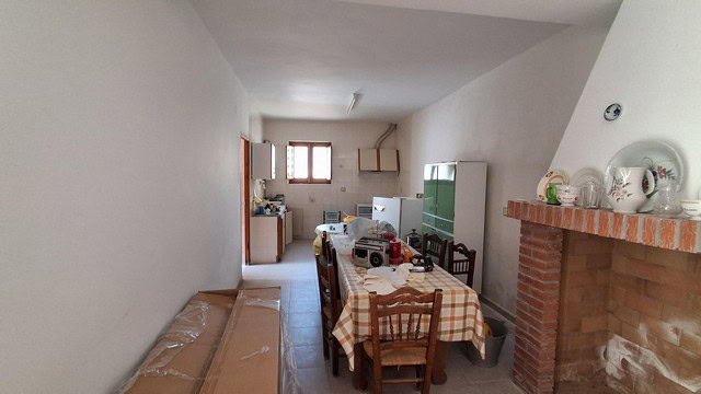 Interior view of a rural property in Seron, Almeria, showing a cozy dining area with simple furnishi.