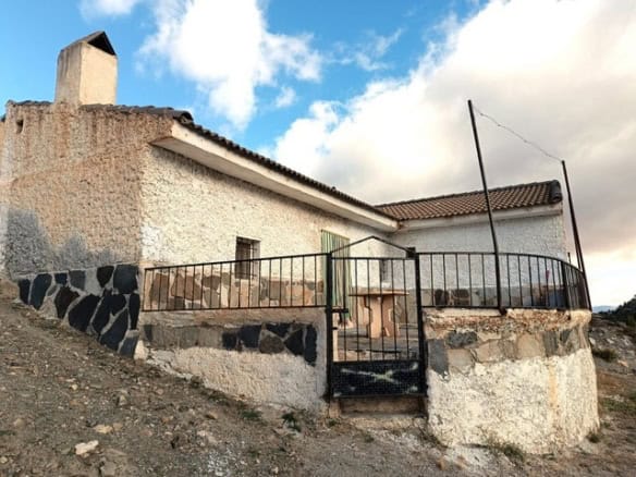 Rural property in Caniles, Granada with traditional architecture and scenic surroundings. Perfect fo.