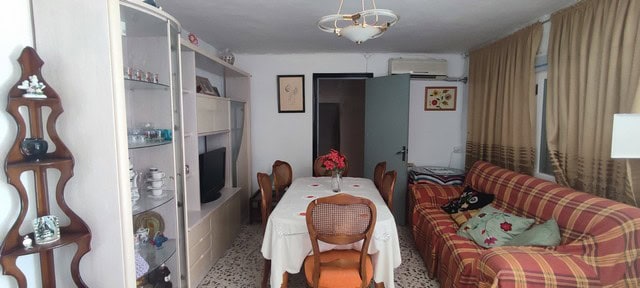 Charming rural home interior in Oria, Almeria, featuring a cozy dining area and traditional decor.