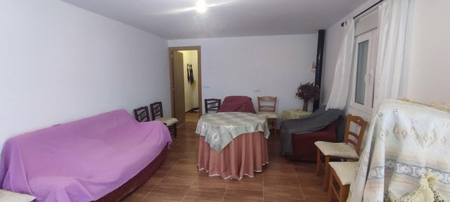 Cozy interior of a rural property in Oria, Almeria with simple furnishings and natural light.