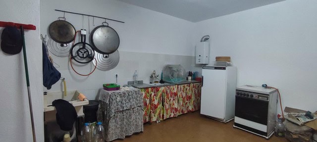 Kitchen in rural property in Oria, Almeria with basic appliances and simple furnishings.