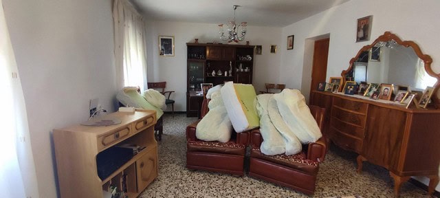 Charming village property in Seron, Almeria, featuring a cozy living room with traditional furnishin.