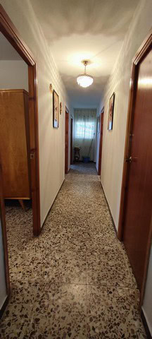 Bright hallway in a traditional village property in Seron, Almeria, featuring wooden doors and class.