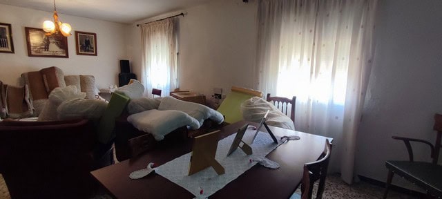 Spacious living room with natural light and traditional decor in a village property in Seron, Almeri.