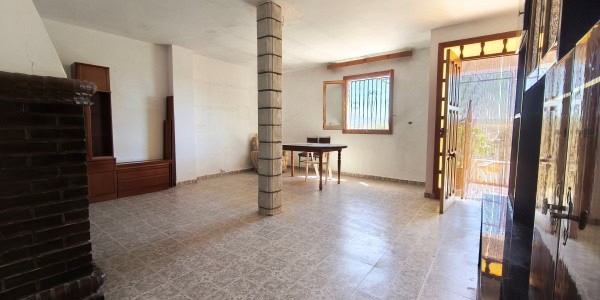 Interior view of a village property in Fontanar, Jaen, showcasing a spacious living area with natura.
