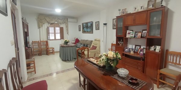Charming village home interior in Fontanar, Jaen, featuring a cozy living room with wooden furniture.