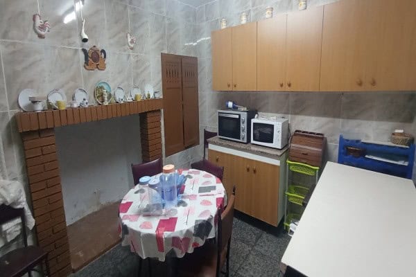 Charming village home interior with kitchen, dining area, and traditional decor in Fontanar, Jaen.