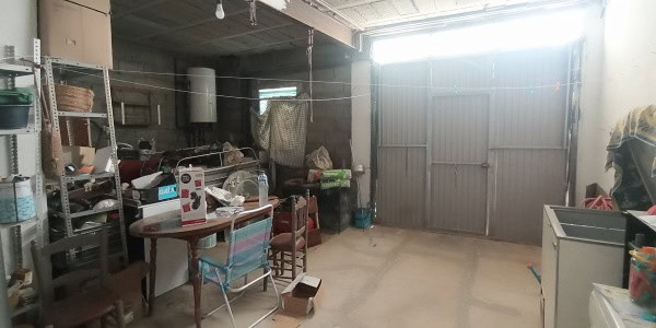 Cave house interior in Fontanar, Jaen, showcasing rustic living space and storage areas.